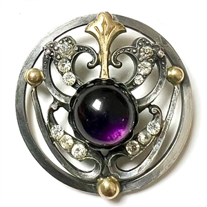 Arts and Crafts button of gilded and silvered metal with amethyst glass center.