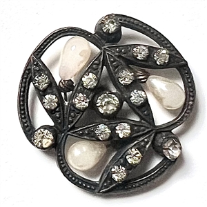 Unique metal button with pastes and pearlized “seeds."