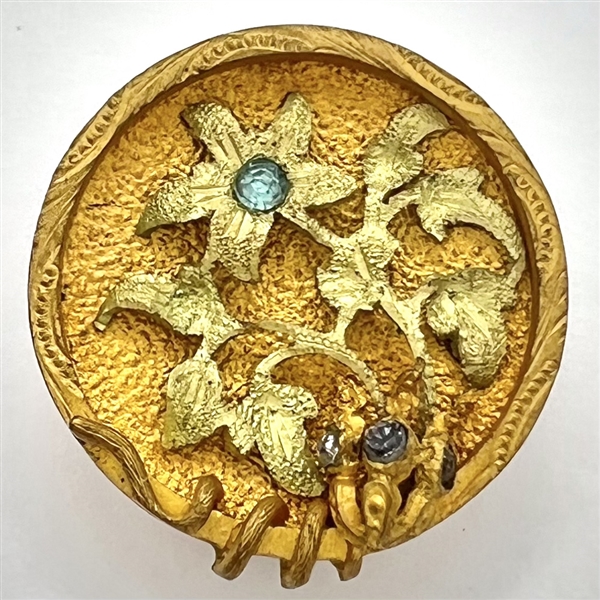 UNUSUAL heavily gilded metal button of flowers with aqua pastes.