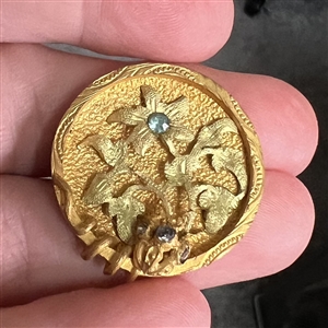 UNUSUAL heavily gilded metal button of flowers with aqua pastes.