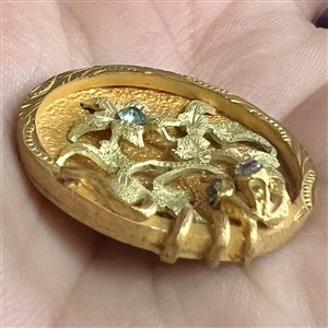 UNUSUAL heavily gilded metal button of flowers with aqua pastes.