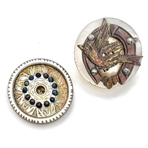 Two cool carved pearl buttons.