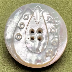 Carved ocean pearl button of a horseshoe.