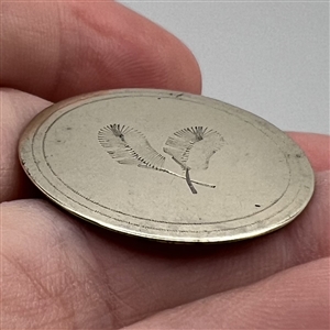 An 18th c. Tombac button of two feathers. 