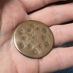 An 18th c. heavily chased copper Colonial button.