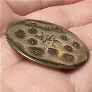 An 18th c. heavily chased copper Colonial button.