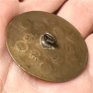 An 18th c. heavily chased copper Colonial button.