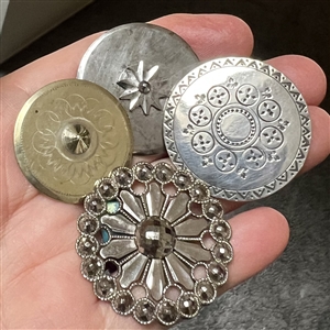 Four 18th c. and 19th c.  metal buttons.