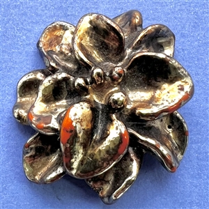 Vintage metalized British Bakelite button of realistic flower.