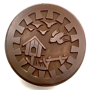Brown glass button of birds and bird house.