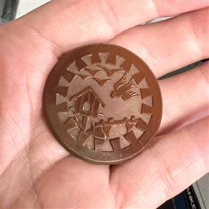 Brown glass button of birds and bird house.