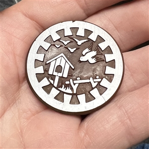 Brown glass button of birds and bird house.