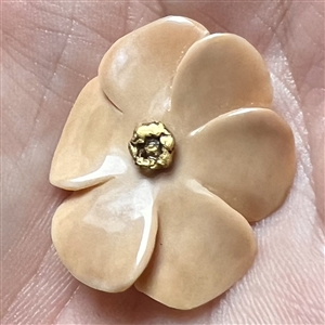 Carved fossilized natural material button of realistic flower with real gold center. 