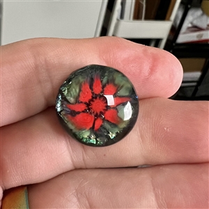 Mary Gaumond's torch-worked glass studio button of red flower.