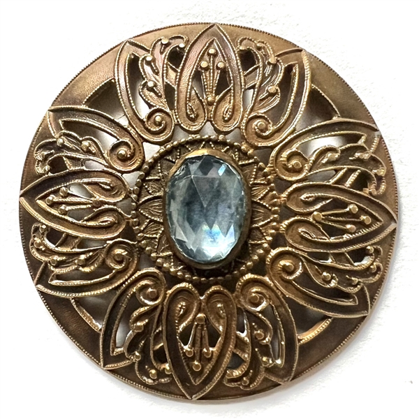 Extra large brass button with oval faceted  glass imitation gem.