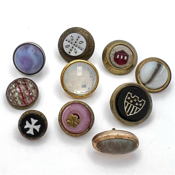 Ten glass in metal weskit buttons including a Cheshire and a Saphiret.