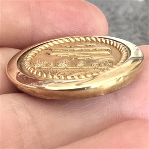 Brass button of an early airplane.