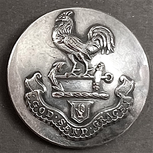 Livery crest button with hand of Ulster rooster standing on an anchor with motto.