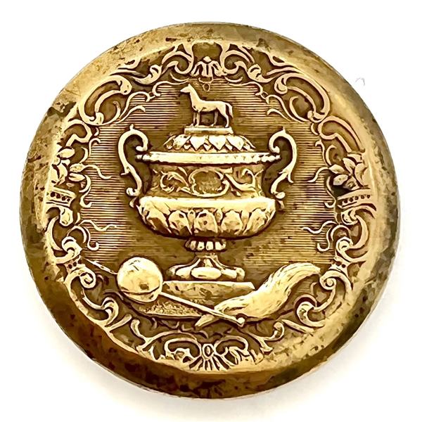 Gilded brass sporting button of a sporting awards cup.