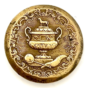 Gilded brass sporting button of a sporting awards cup.