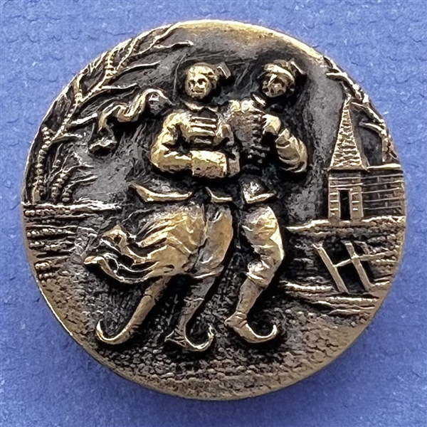 Brass button of ice skaters. 