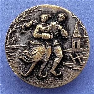 Brass button of ice skaters. 