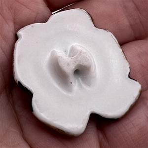 French couture ceramic button of flowers and bow designed by Roger Jean-Pierre for Schiaparelli.