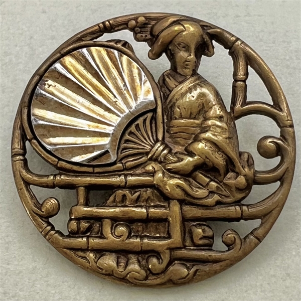 Brass button of “Madame Chrysanthemum."