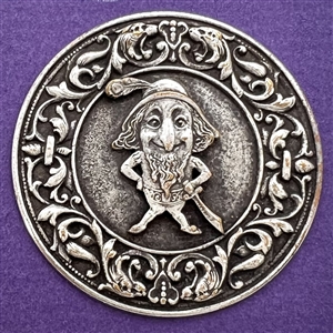 French silvered metal button of a gnome.