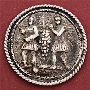 Dutch silver button of men carrying grapes.