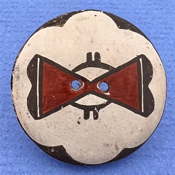 Zia pueblo ceramic pottery button with geometric pattern.