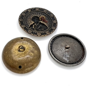 Three brass story buttons.