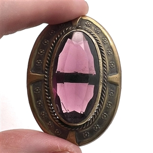 Gay 90's faceted amethyst glass set in metal button.