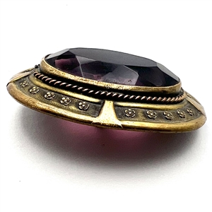 Gay 90's faceted amethyst glass set in metal button.