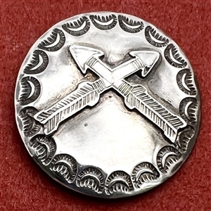 Modern Native American silver button of crossed arrows.