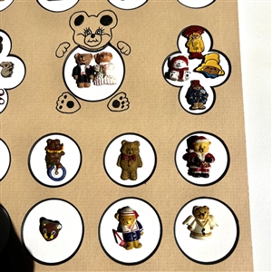 Card of 26 teddy bear and other buttons.