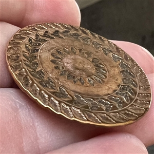 An 18th c. heavily chased copper Colonial button.