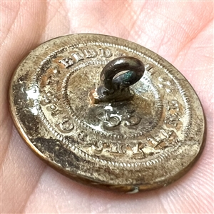 Livery crest button of a mermaid.