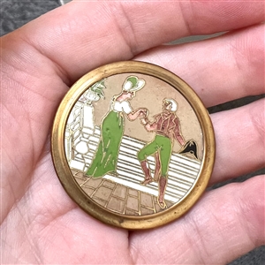 Champlevé enamel button of woman and man from the opera “Madame Sans Gene.