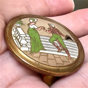 Champlevé enamel button of woman and man from the opera “Madame Sans Gene.