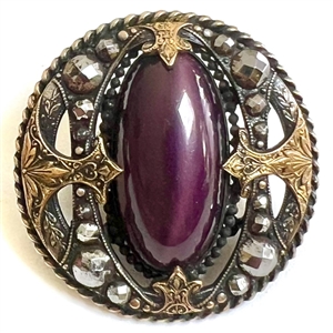 True gay 90s button with oval glass center and unique mounting.