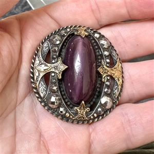True gay 90's button with oval glass center and unique mounting.