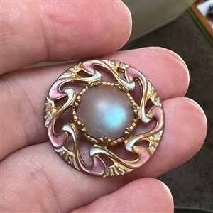 Art Nouveau button of saphiret glass set in painted metal.