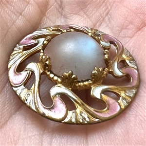Art Nouveau button of saphiret glass set in painted metal.