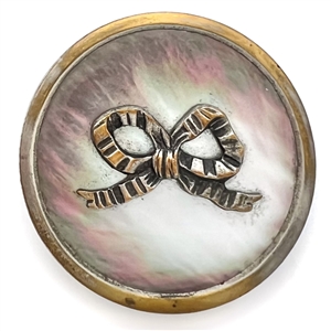 A 19th c. Iridescent pearl button with silvered brass bow.
