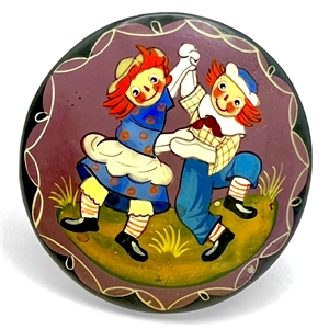 Russian lacquer button of dancing “Raggedy Ann and Andy."
