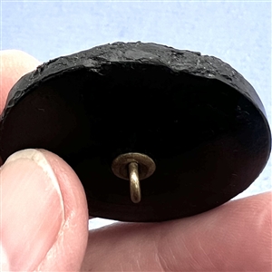 Black glass button of boy in a swan boat.