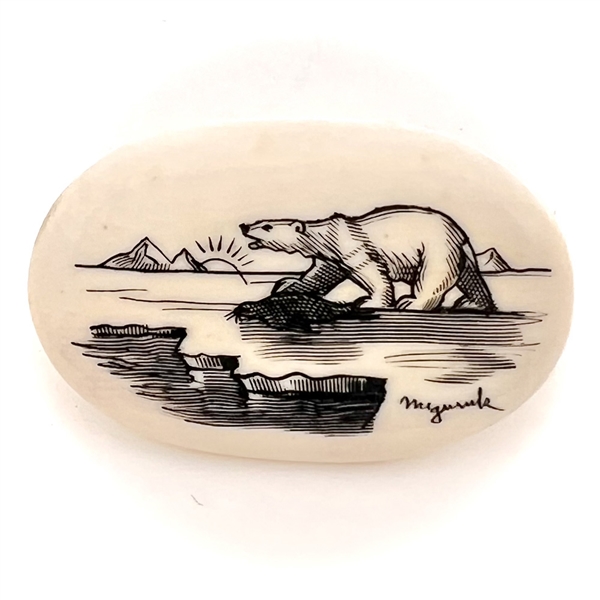 Scrimshaw button of an polar bear on ice.