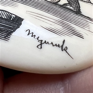 Scrimshaw button of an polar bear on ice.