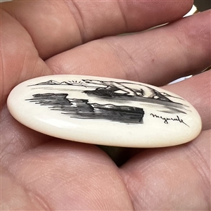 Scrimshaw button of an polar bear on ice.
